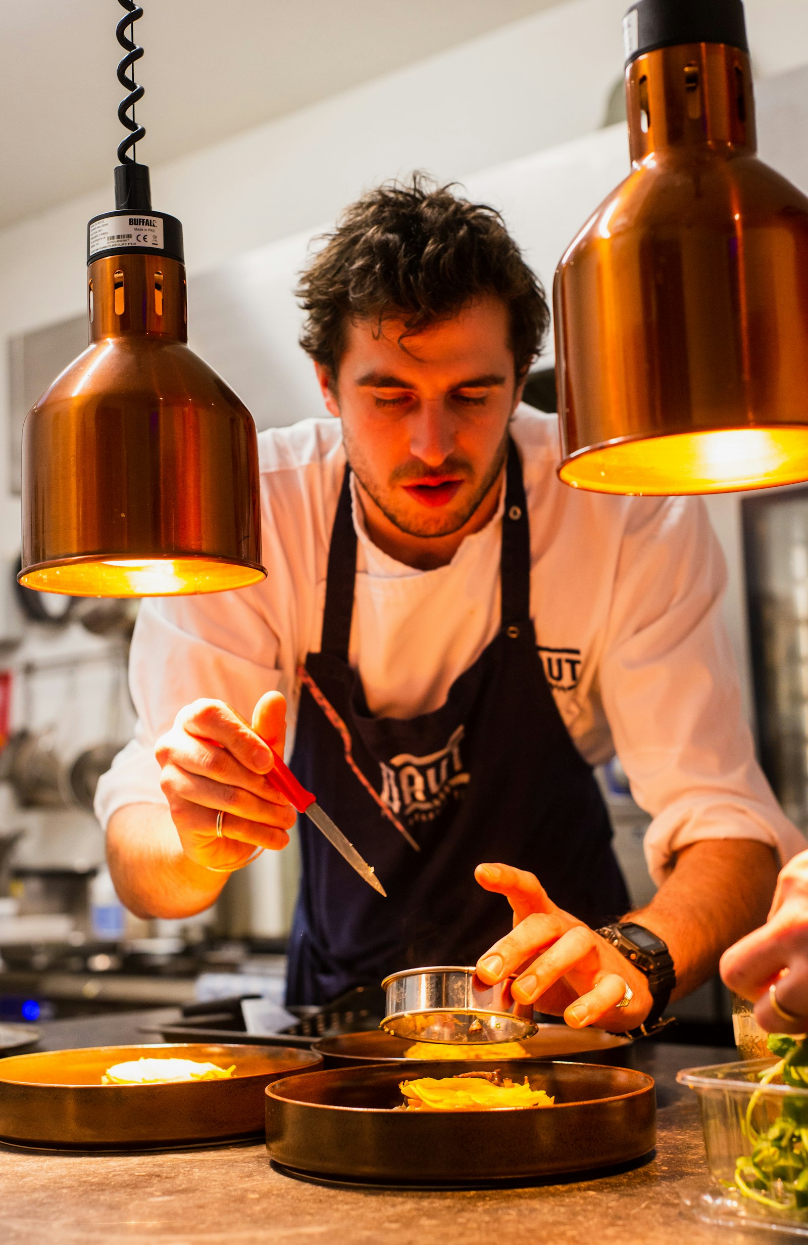 Chef plating a dish